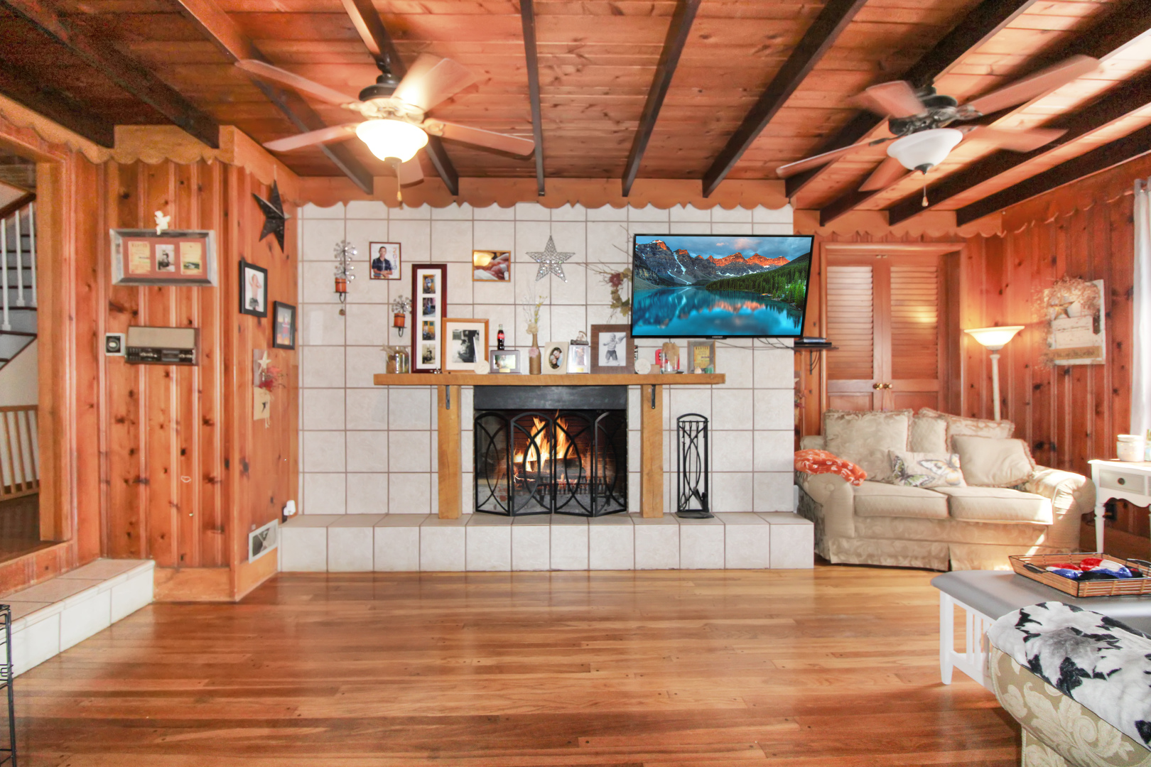 9033 Crego Road Waterman, IL 60556 - Photo 7 of 21 a living room with furniture a fireplace and a table
