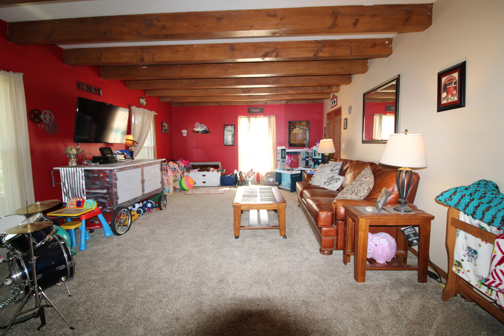 9033 Crego Road Waterman, IL 60556 - Photo 9 of 21 a living room with furniture and a flat screen tv