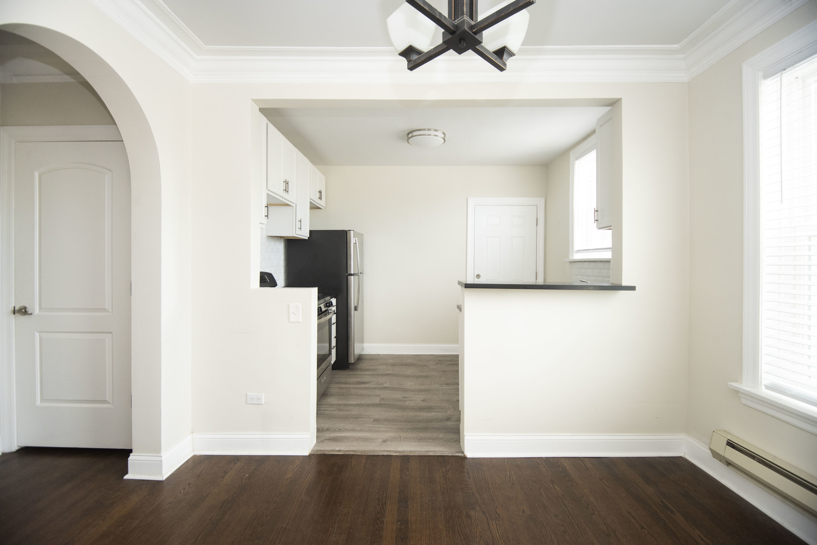 918 Green Bay Road, Unit 3H Winnetka, IL 60093 - Photo 10 of 14 an empty room with wooden floor and windows