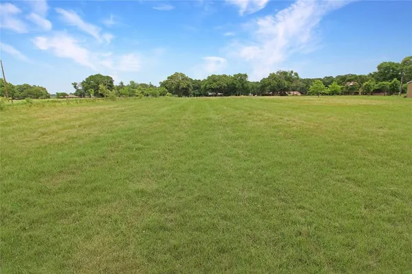 a view of a field with an outdoor space