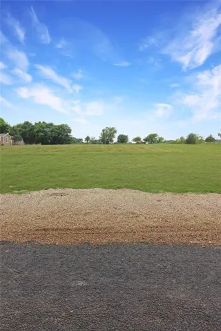 a view of a field with an outdoor space