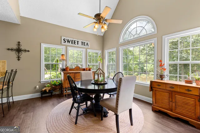 a bath tub sitting in a bathroom next to a window
