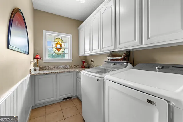 a bedroom with furniture and a ceiling fan