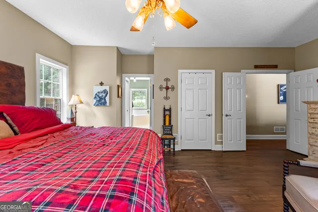 a living room with furniture a rug and a chandelier