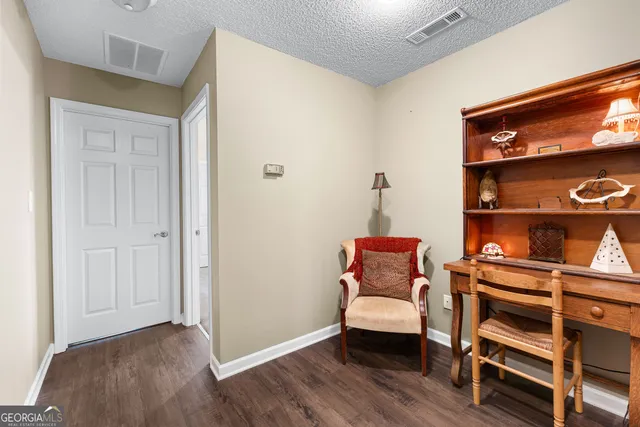 a view of a backyard with large trees