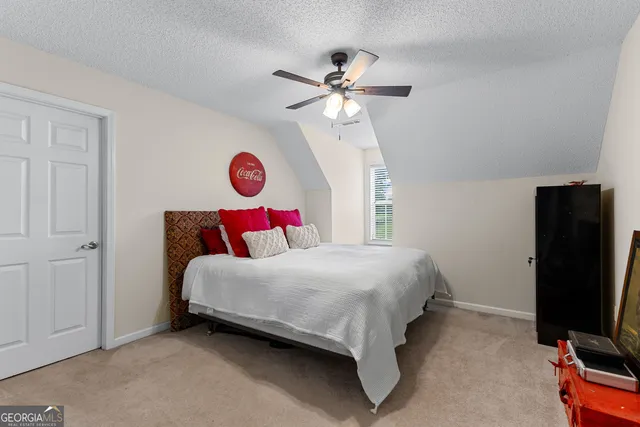 a view of a house with yard and a garden