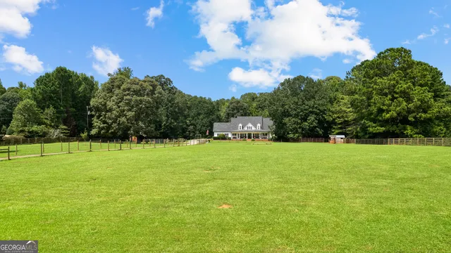an aerial view of residential house with swimming pool