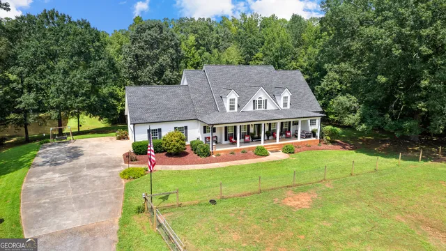 a view of a balcony with furniture and wooden floor
