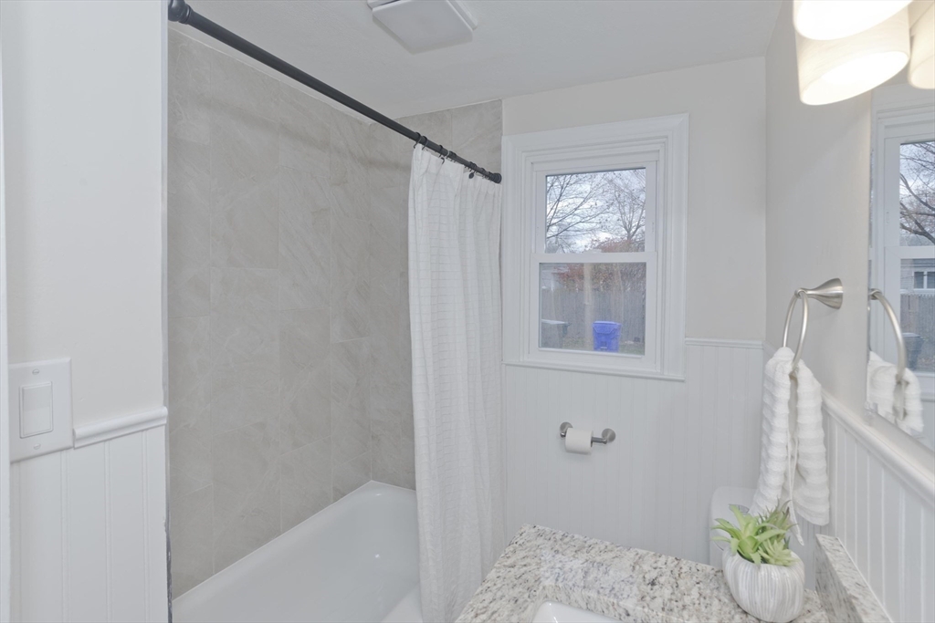 99 Massreco Street Springfield, MA 01109 - Photo 17 of 40 a bathroom with a bathtub and shower