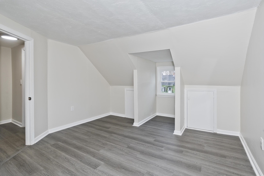99 Massreco Street Springfield, MA 01109 - Photo 22 of 40 a view of an empty room with wooden floor