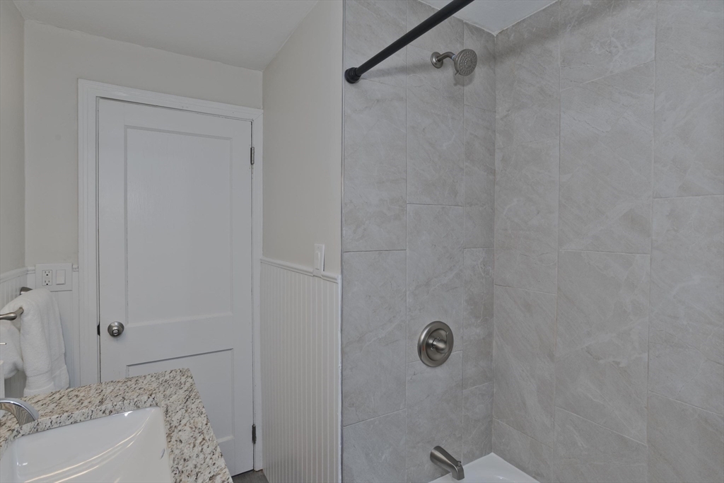 99 Massreco Street Springfield, MA 01109 - Photo 25 of 40 a bathroom with a bathtub and shower