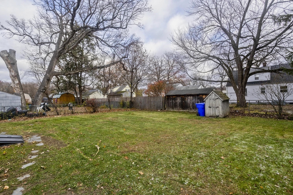 99 Massreco Street Springfield, MA 01109 - Photo 29 of 40 a front view of a house with a yard and garage