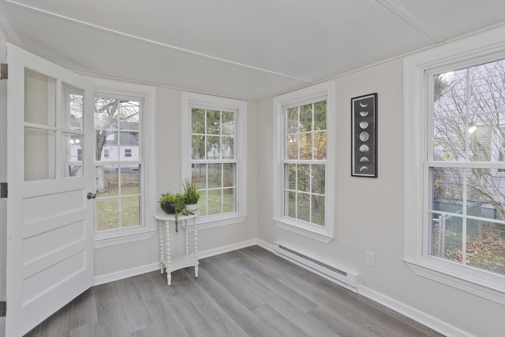99 Massreco Street Springfield, MA 01109 - Photo 4 of 40 a view of an entryway with wooden floor and windows