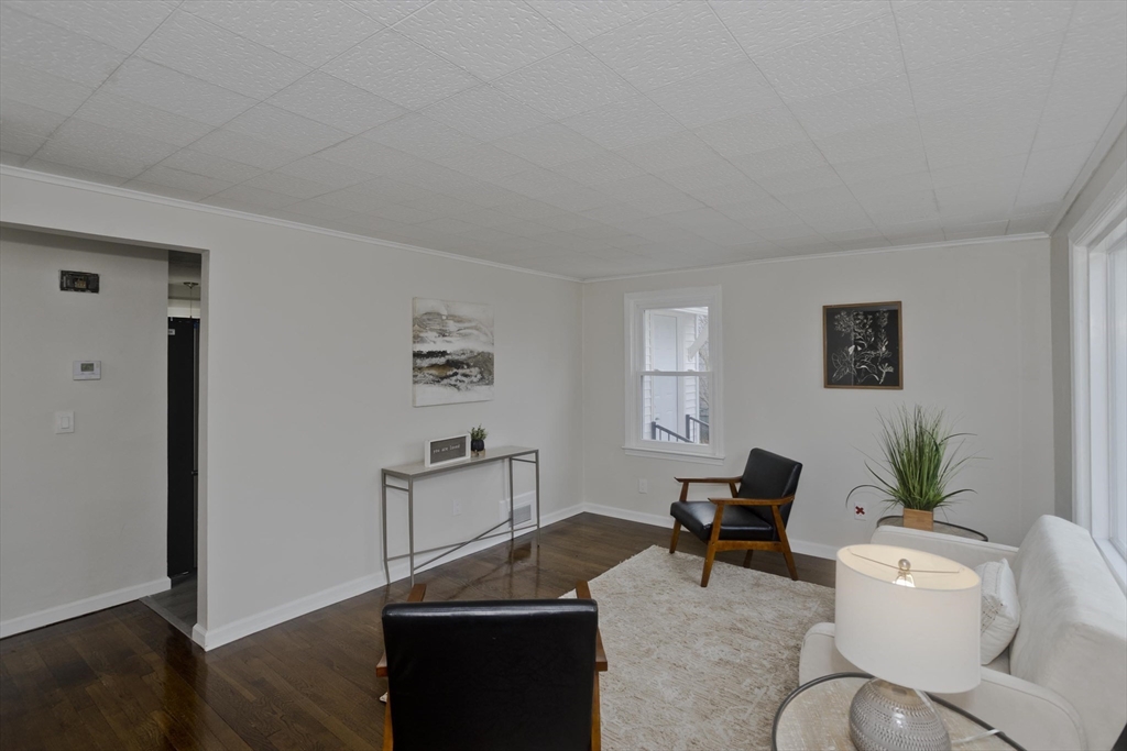 99 Massreco Street Springfield, MA 01109 - Photo 7 of 40 a living room with furniture and wooden floor