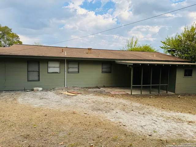 a house with a tree in front of it