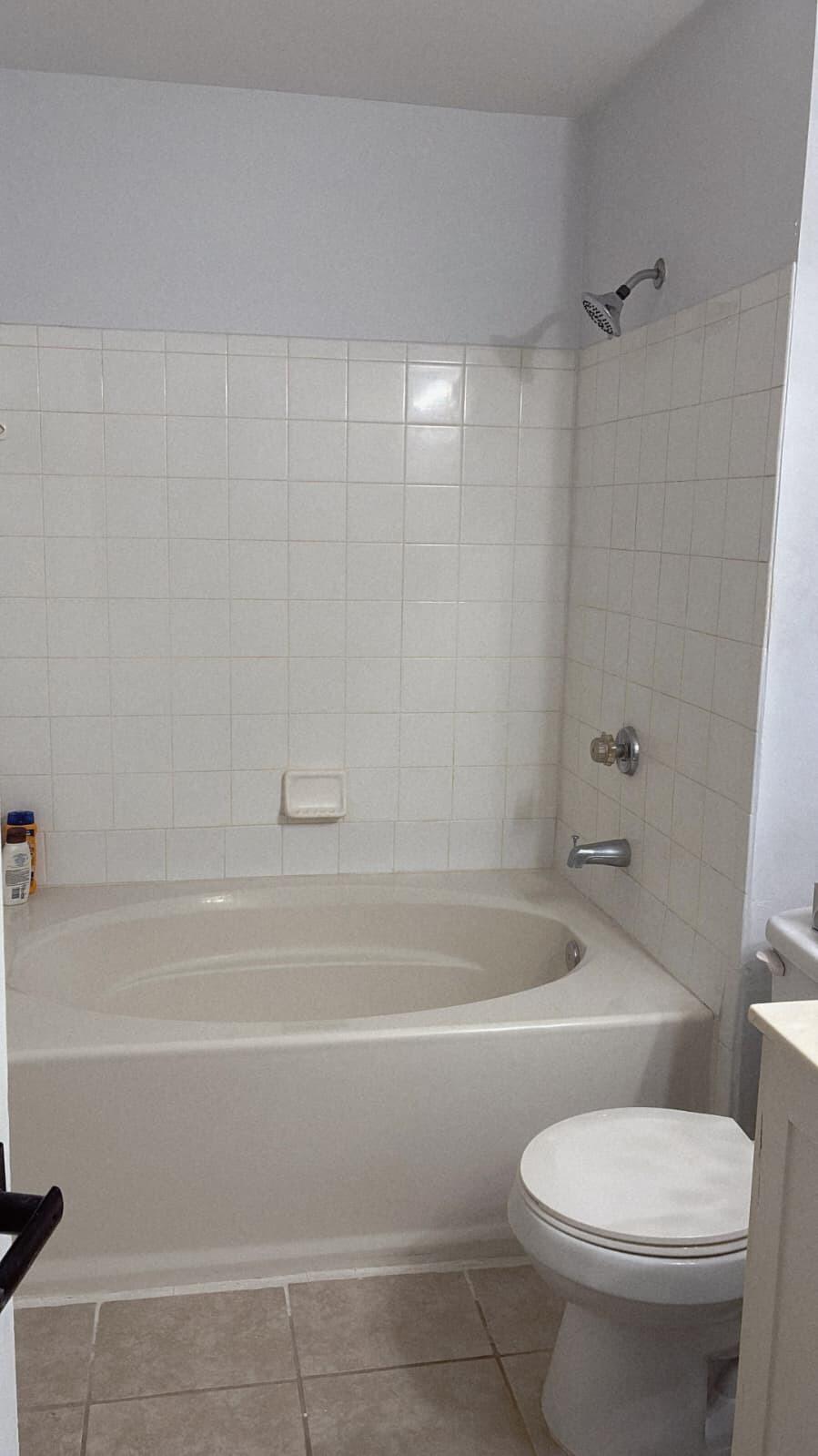 4863 Via Palm Lakes, Unit 812 West Palm Beach, FL 33417 - Photo 16 of 27 a bathroom with a toilet and a bath tub