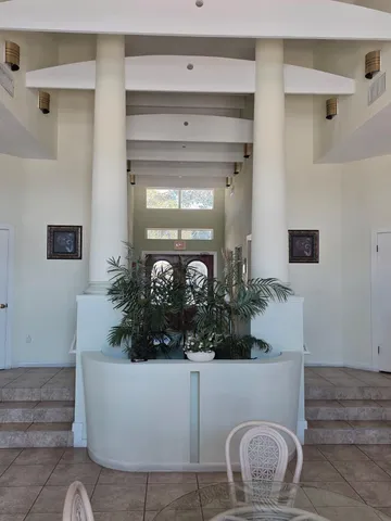 a bathroom with a potted plant and a sink