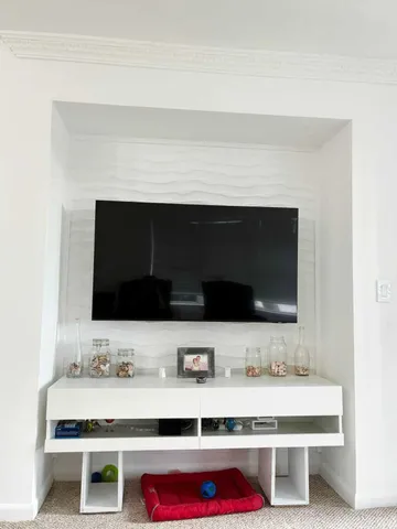 a bathroom with a sink and a microwave