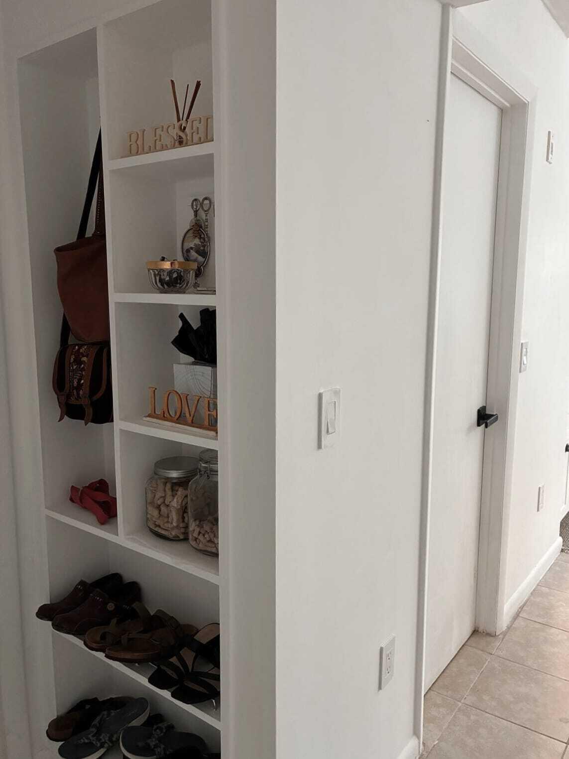 4863 Via Palm Lakes, Unit 812 West Palm Beach, FL 33417 - Photo 9 of 27 a room with a wooden floor and shoes