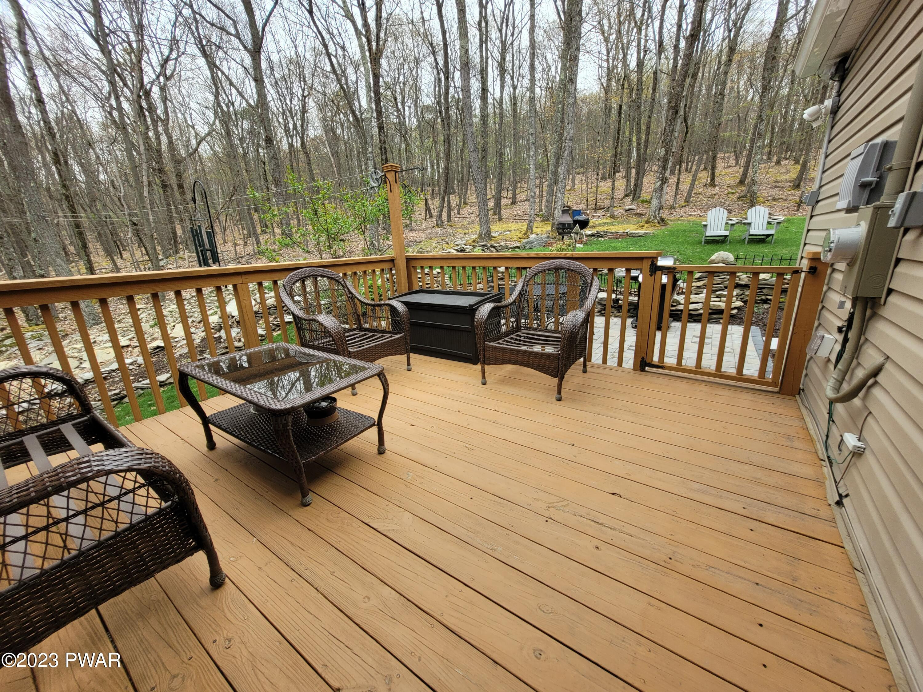 122 Hemlock Road Milford, PA 18337 - Photo 17 of 19 a balcony with wooden floor and outdoor seating
