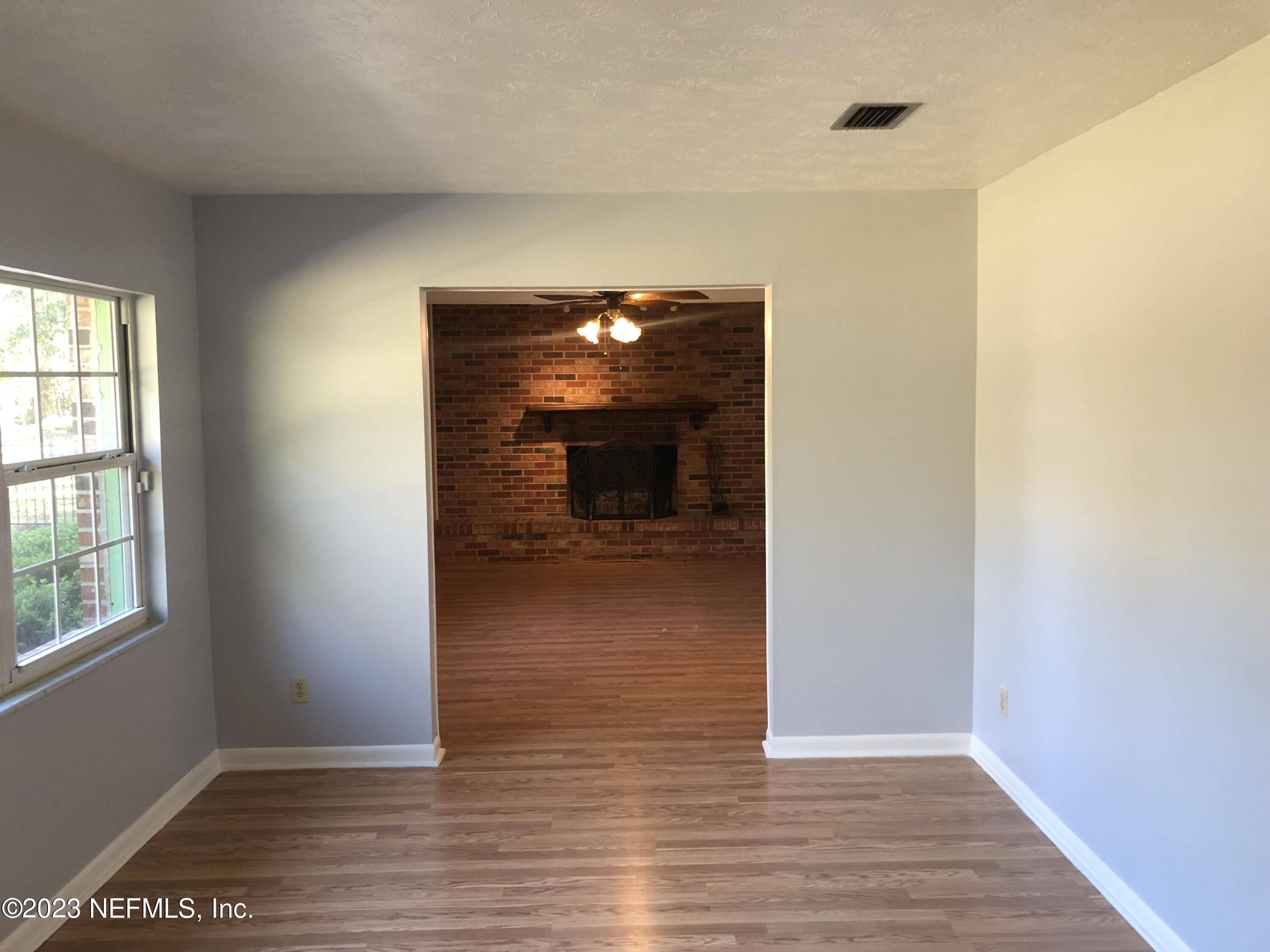 326 Blake Avenue Orange Park, FL 32073 - Photo 16 of 25 a view of a livingroom with wooden floor