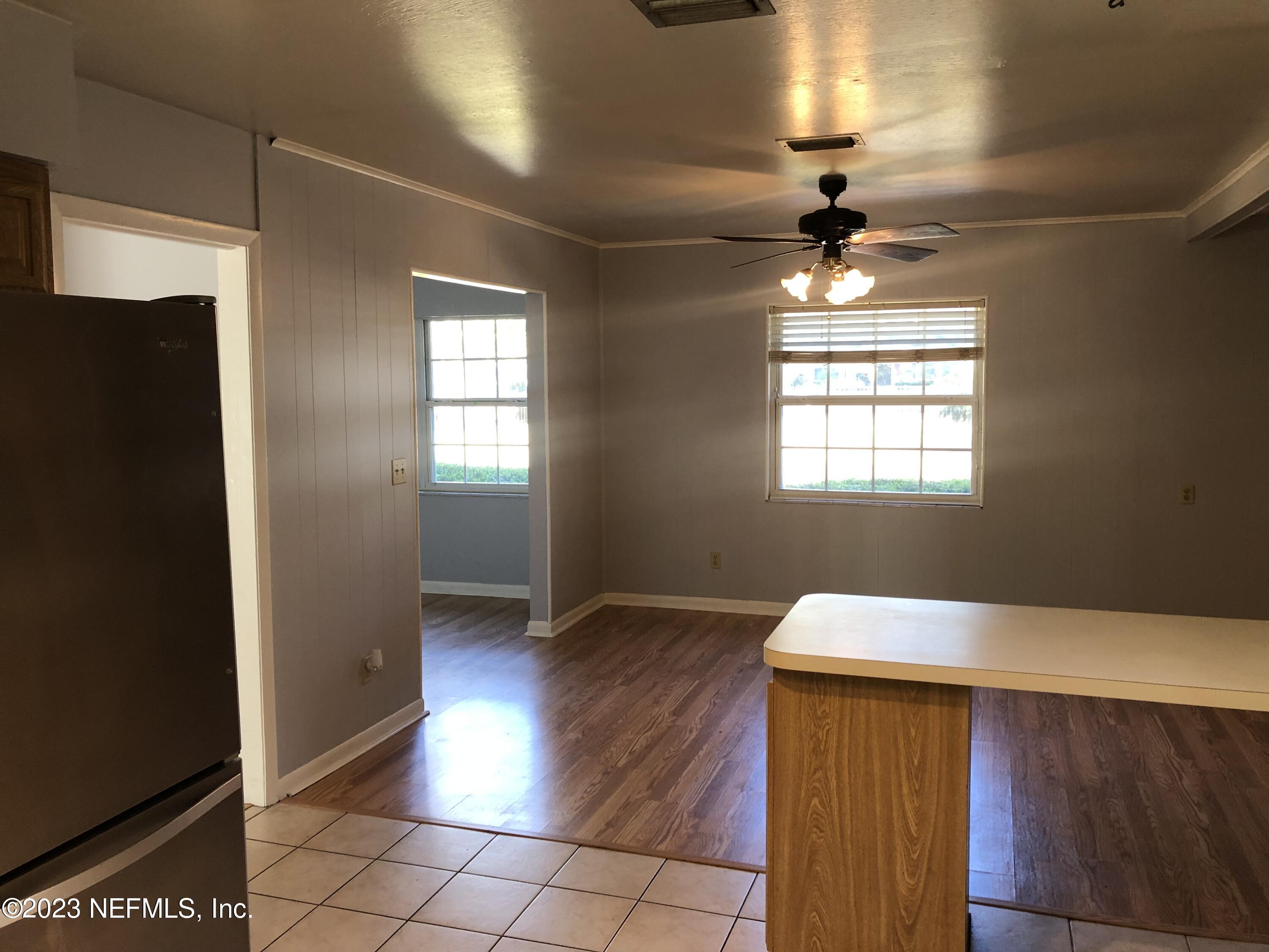 326 Blake Avenue Orange Park, FL 32073 - Photo 18 of 25 a view of an empty room with window and wooden floor