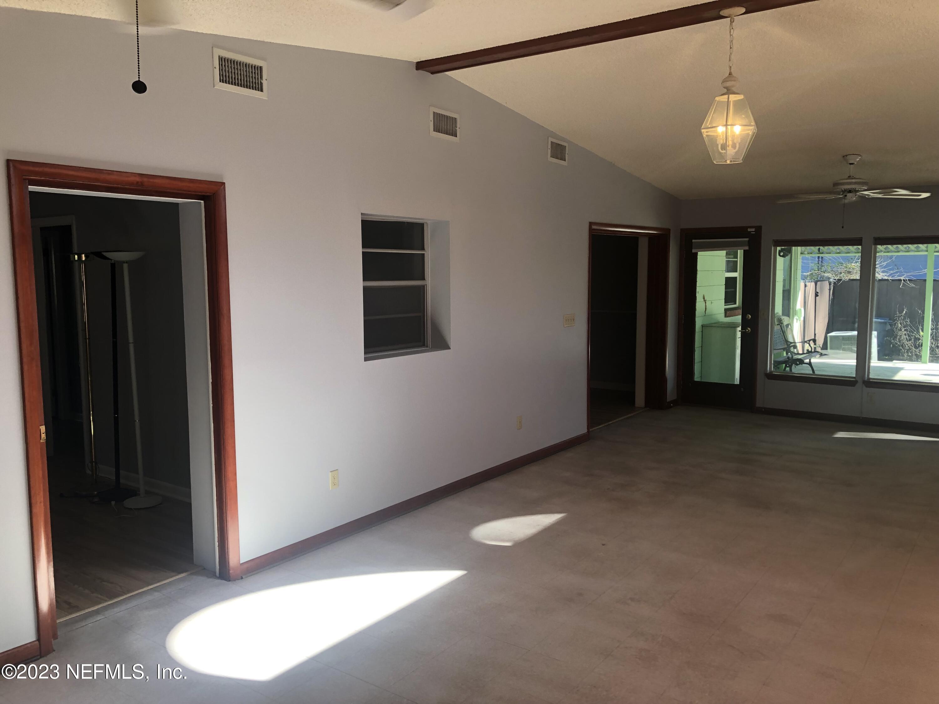 326 Blake Avenue Orange Park, FL 32073 - Photo 5 of 25 a view of a livingroom with a ceiling fan and window