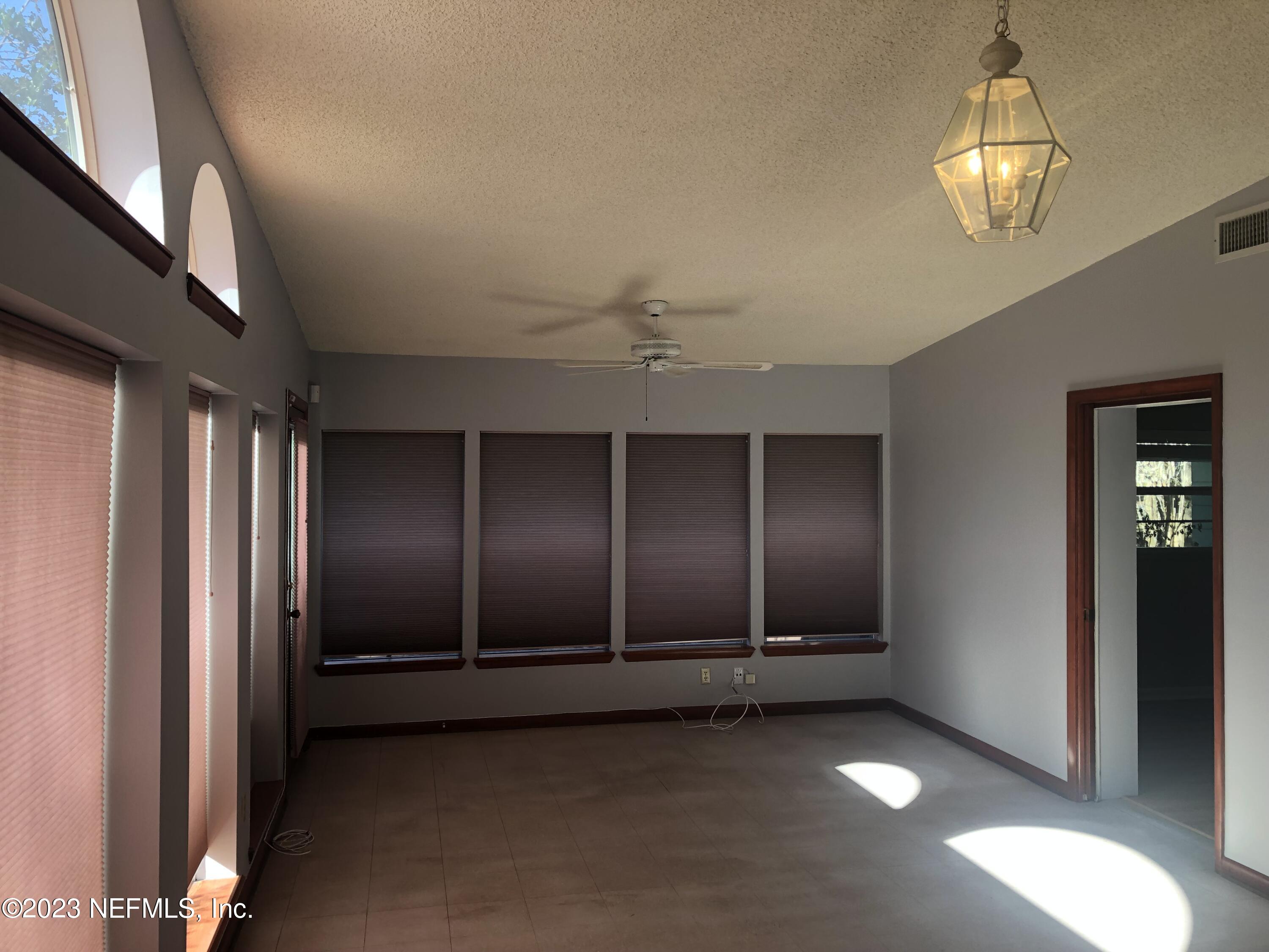 326 Blake Avenue Orange Park, FL 32073 - Photo 7 of 25 a view of an empty room with a window