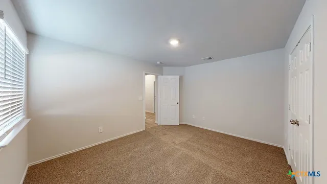 an empty room with windows