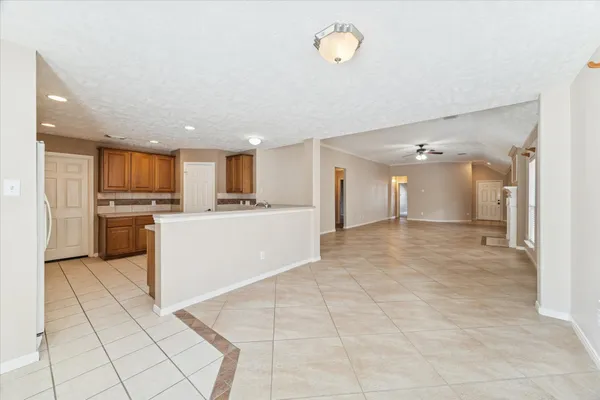 a kitchen with a sink a stove cabinets and counter space