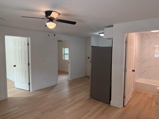 4605 North Hubert Avenue, Unit 19 Tampa, FL 33614 - Photo 4 of 14 an empty room with wooden floor closet and windows