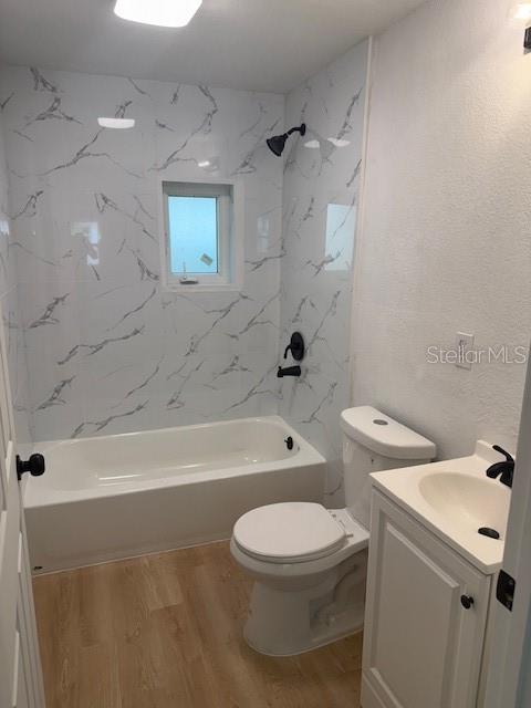 4605 North Hubert Avenue, Unit 19 Tampa, FL 33614 - Photo 5 of 14 a bathroom with a toilet a sink and bathtub