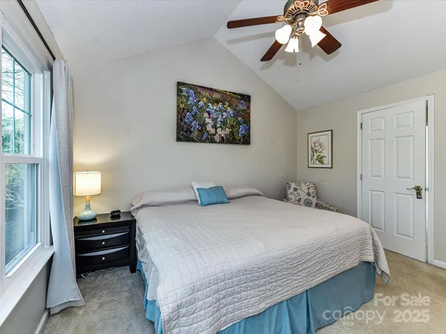 a bedroom with bed and a window