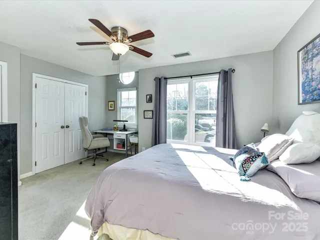 a bathroom with a toilet and shower