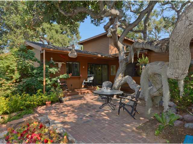 3058 Green Canyon Road Fallbrook, CA 92028 - Photo 16 of 25 Looking towards the house from the private brick patio area. The window/door towards the left are in the Kitchen/Dining Area and the window to the right is in the Guest Bedroom