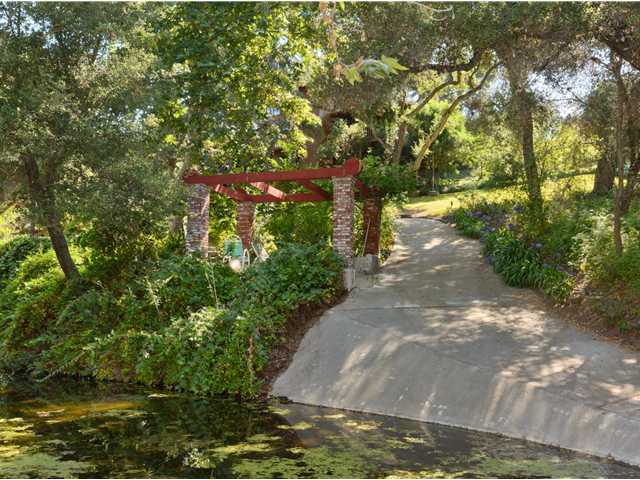 3058 Green Canyon Road Fallbrook, CA 92028 - Photo 20 of 25 Looking from the pond towards the meandering pathway leading to the house and to the guest house