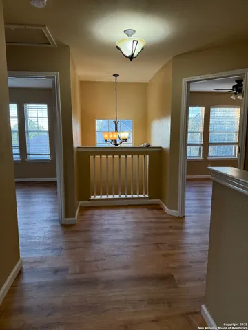 a view of a livingroom with wooden floor
