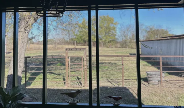 a view of a room with a large window