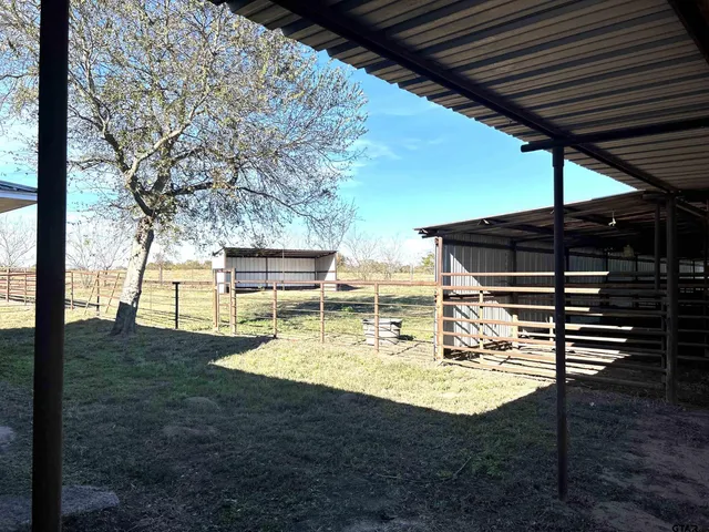 a view of a swimming pool with a patio