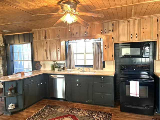 a kitchen with a sink and cabinets