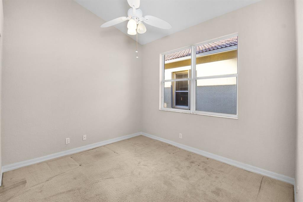 7084 Southeast Cricket Court Stuart, FL 34997 - Photo 21 of 51 an empty room with a window