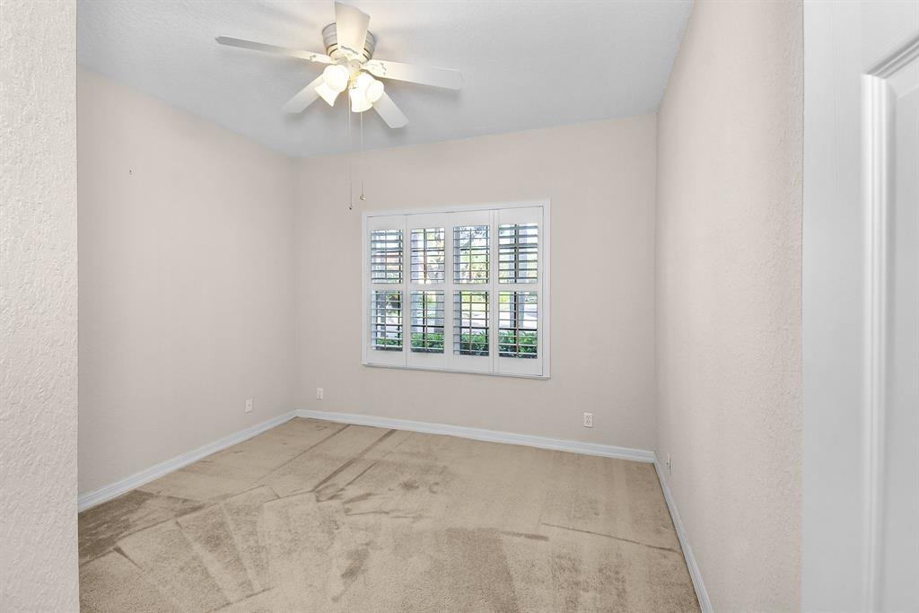 7084 Southeast Cricket Court Stuart, FL 34997 - Photo 23 of 51 a view of an empty room with a window