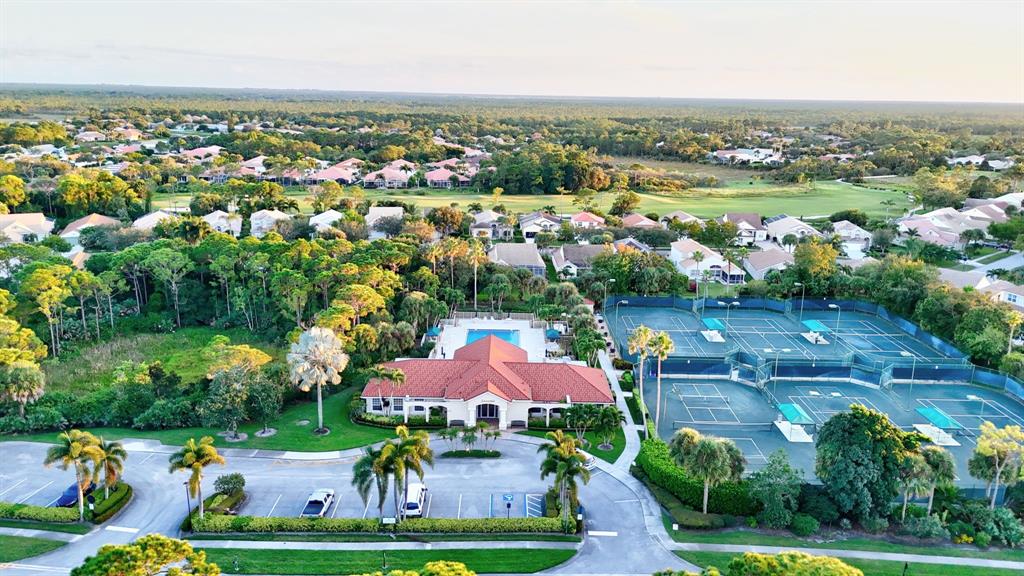 7084 Southeast Cricket Court Stuart, FL 34997 - Photo 47 of 51 an aerial view of a houses with a garden and lake view