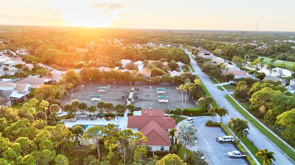 7084 Southeast Cricket Court Stuart, FL 34997 - Photo 49 of 51 an aerial view of residential houses with outdoor space