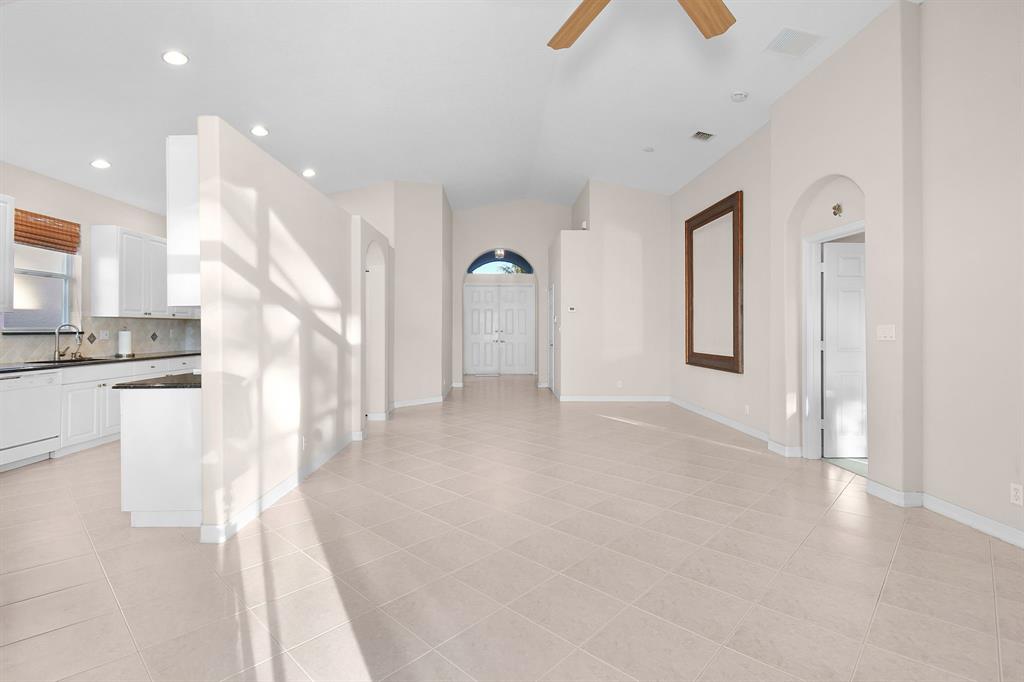7084 Southeast Cricket Court Stuart, FL 34997 - Photo 7 of 51 a view of a kitchen with a sink and cabinets