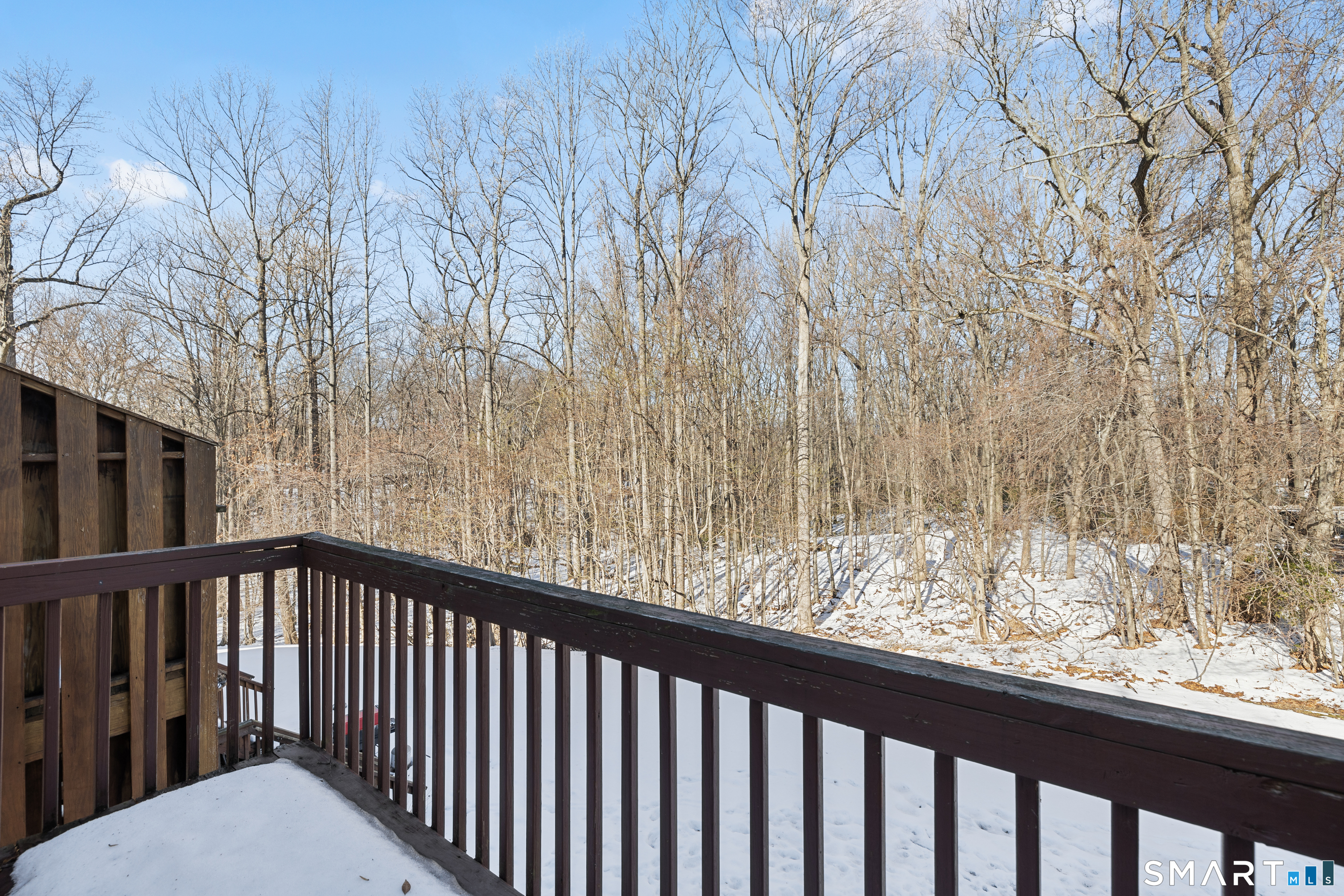 181 Sherbrook Street, Unit A3 Bristol, CT 06010 - Photo 12 of 18 a view of balcony with wooden floor and fence