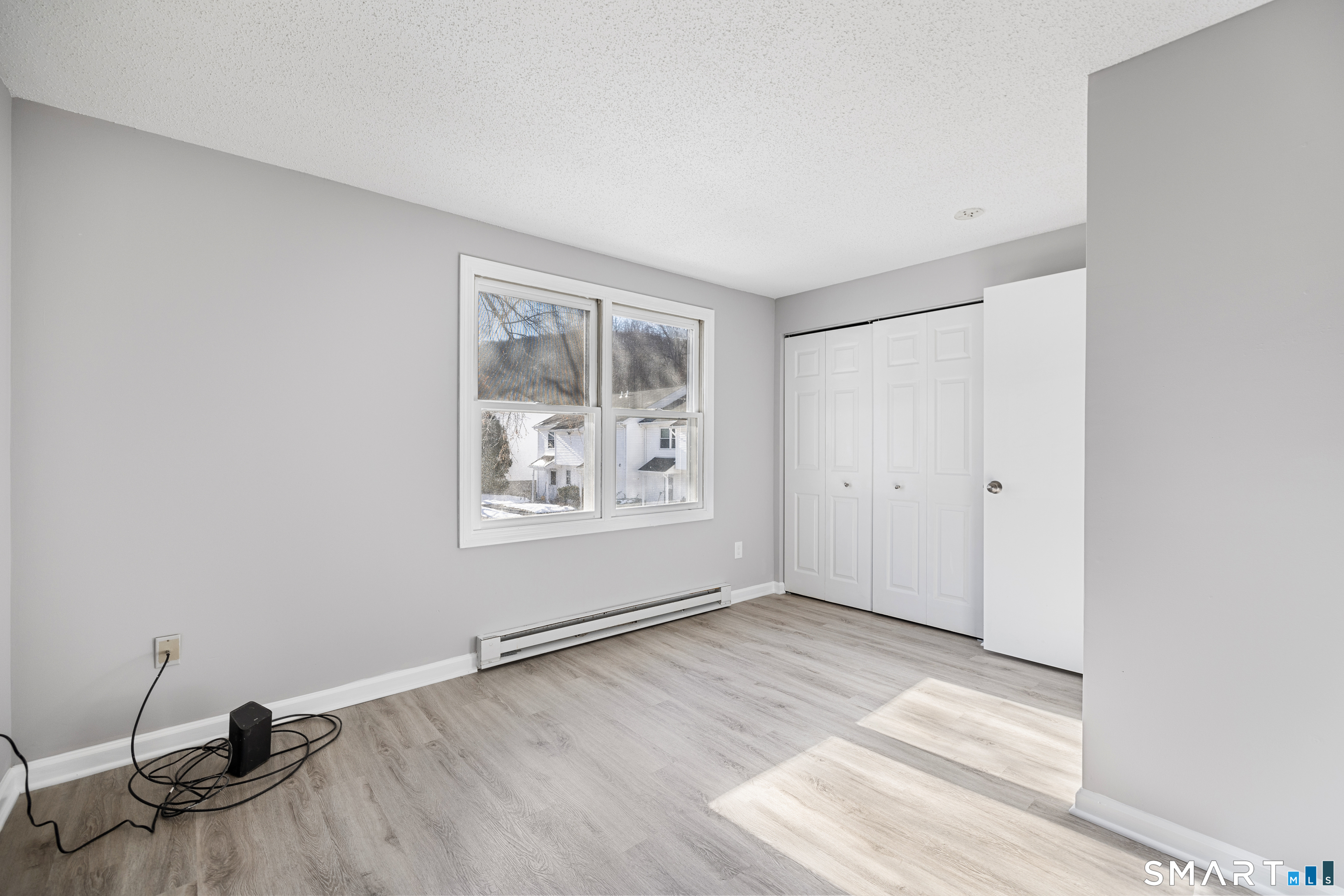 181 Sherbrook Street, Unit A3 Bristol, CT 06010 - Photo 14 of 18 an empty room with windows