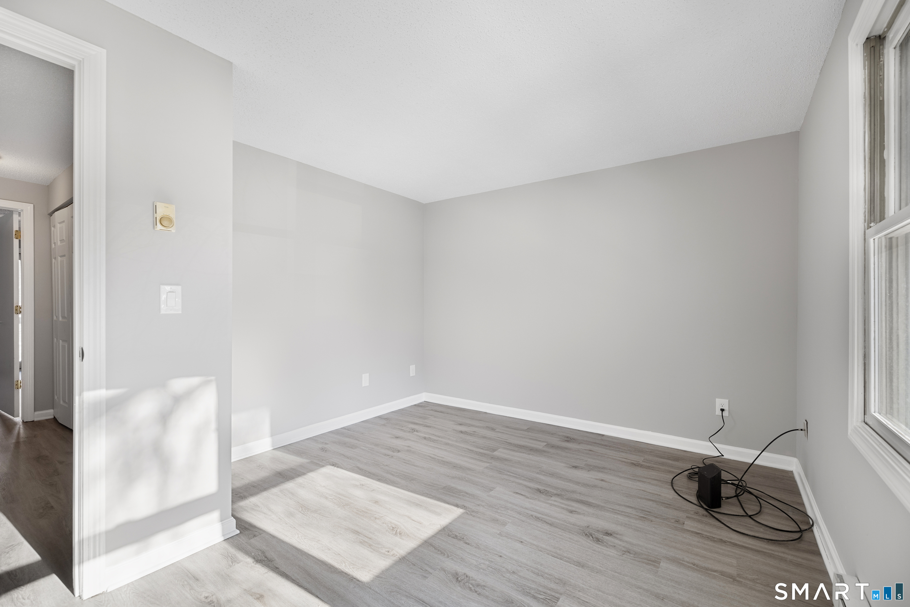 181 Sherbrook Street, Unit A3 Bristol, CT 06010 - Photo 15 of 18 a view of a room with wooden floor and bathroom