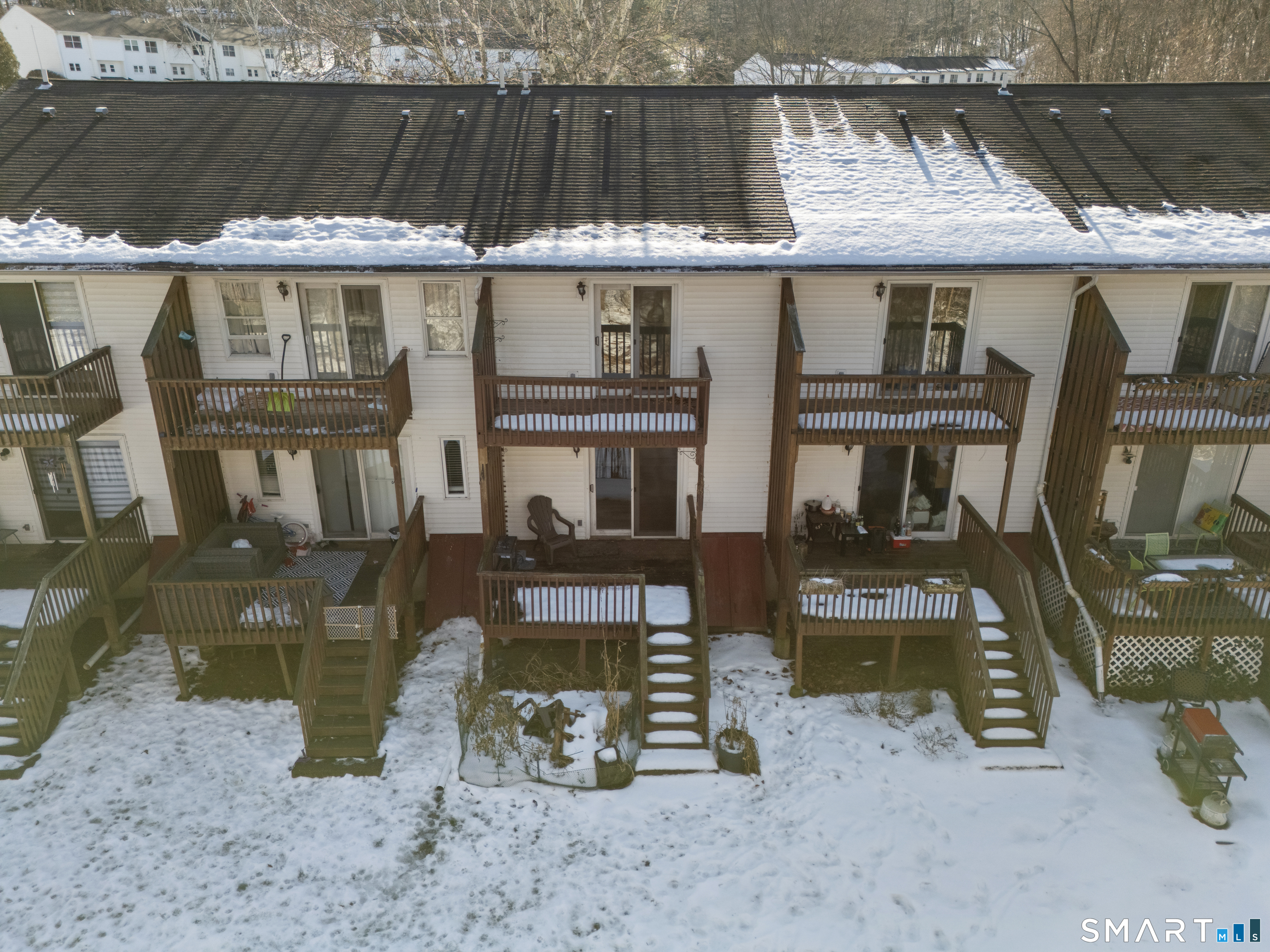 181 Sherbrook Street, Unit A3 Bristol, CT 06010 - Photo 16 of 18 a view of a dinning table and chairs in the roof deck