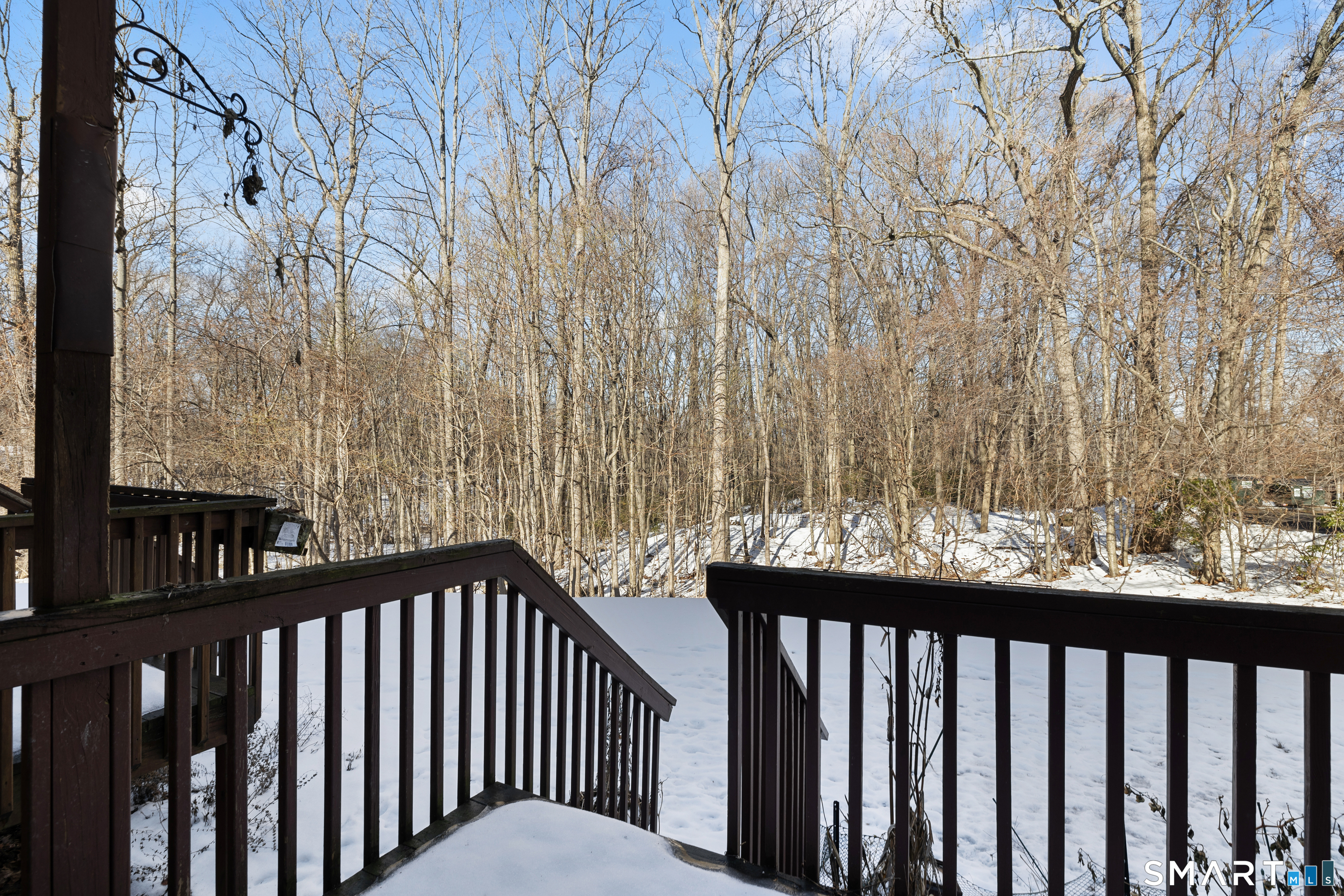 181 Sherbrook Street, Unit A3 Bristol, CT 06010 - Photo 17 of 18 a view of a balcony with wooden fence